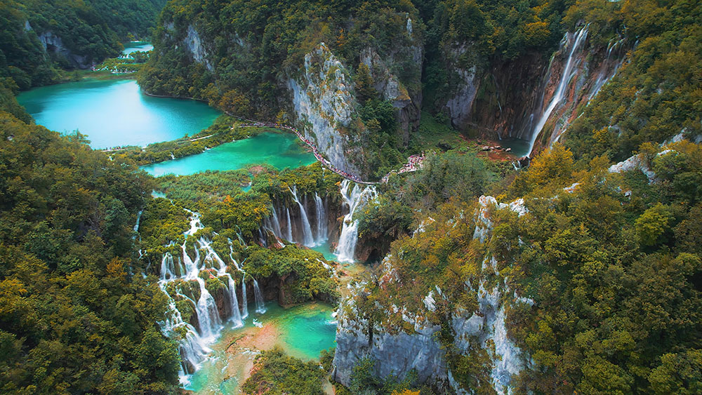 Waterfalls,In,The,Autumn,Forest,Flowing,Into,Lakes.,Tourists,Visit Croatia for Digital Nomads