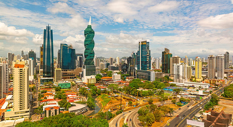 The cityscape of Panama city with its most famous skyscrapers in the financial district at sunrise with the morning traffic on the highway, Panama, Central America. The cityscape of Panama city with its most famous skyscrapers in the financial district at sunrise with the morning traffic on the highway, Panama, Central America.